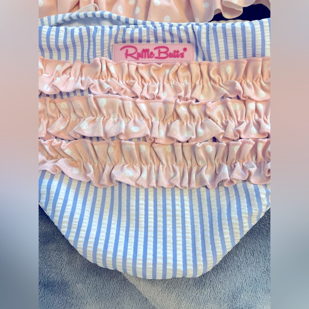 Long sleeved two piece ruffle butts swim suit